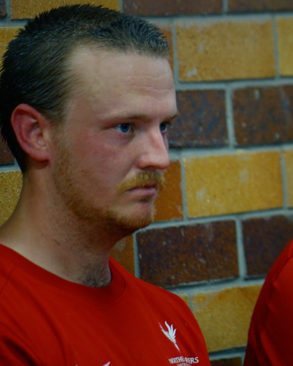 A Northern Rivers player against the brick of the away tunnel before game 005.